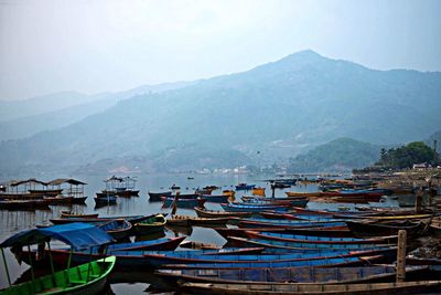 Scenic view of calm sea with mountains in background