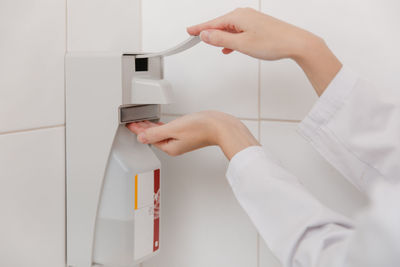 Cropped hand of person washing hands