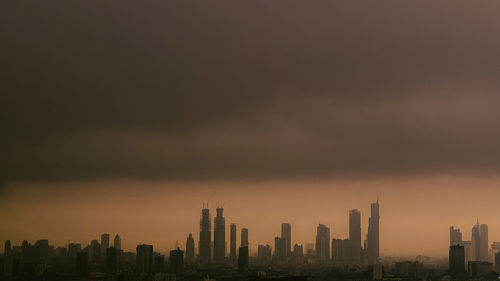 Cityscape against sky during sunset