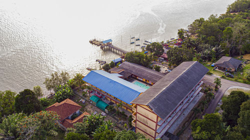 High angle view of buildings and sea against sky