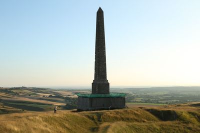 Built structure on field against clear sky
