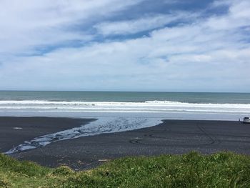 Scenic view of beach against sky