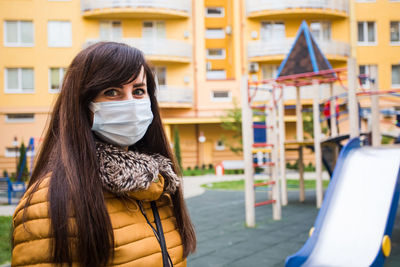 Portrait of woman standing outdoors