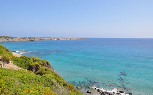 Scenic view of sea against clear blue sky