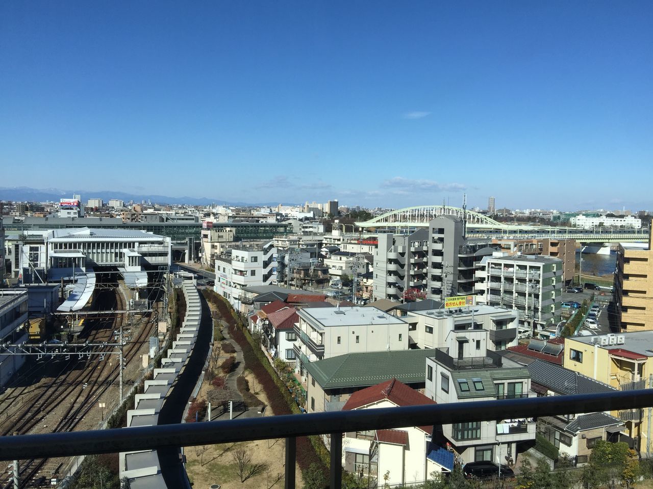 architecture, building exterior, built structure, cityscape, city, high angle view, crowded, residential district, clear sky, residential structure, blue, copy space, residential building, city life, sky, outdoors, day, tower, capital cities, no people