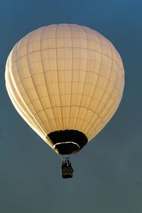 Low angle view of hot air balloon against clear sky