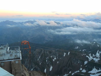 High angle view of snowcapped mountains against sky