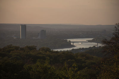 High angle view of river and buildings in city