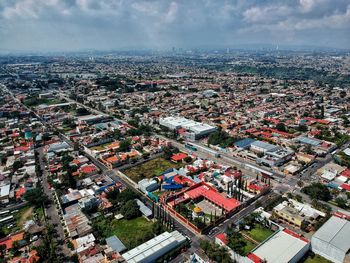 High angle view of illuminated cityscape against sky