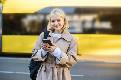 Young woman using mobile phone