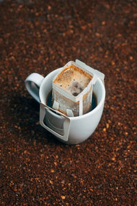 High angle view of coffee cup on table