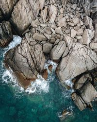 High angle view of rocks in sea