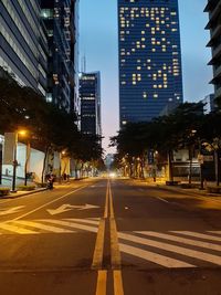 City street and buildings against sky