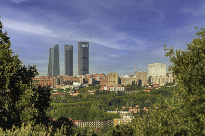 Buildings in city against sky