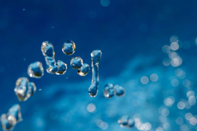 Close-up of water drops on blue sea