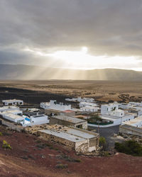 High angle view of townscape against sky during sunset