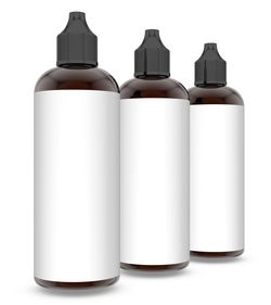 Close-up of empty medicine bottles with black labels against white background