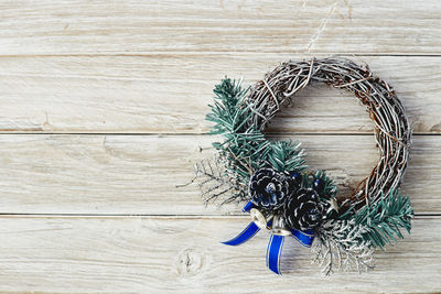 High angle view of wreath on wooden table