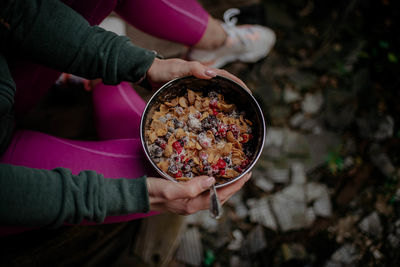 Midsection of woman holding ice cream