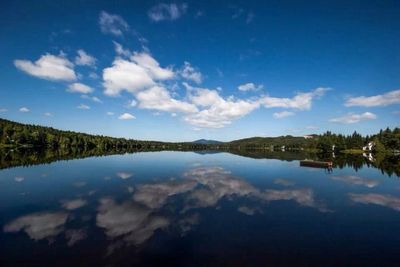 Reflection of clouds in calm lake