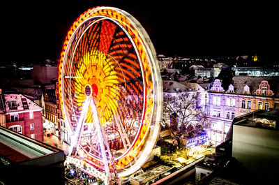 Illuminated ferris wheel at night