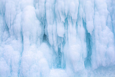 Blue ice stalactite on cliff, winter season in siberia, russia, nature background image