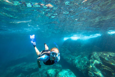 Woman swimming in sea