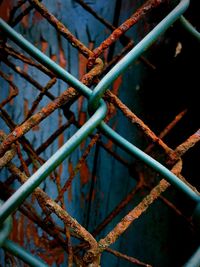 Close-up of rusty metal fence