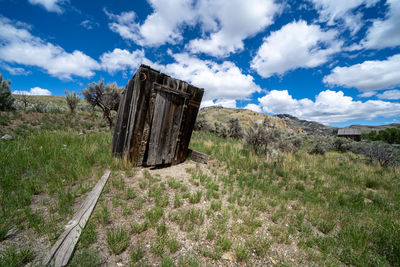 Old ruin on field against sky