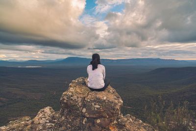 Scenic view of mountains against cloudy sky
