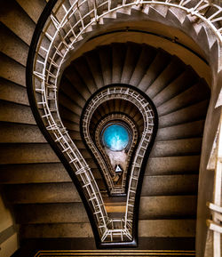 Directly below shot of spiral staircase of building