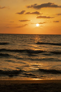 Scenic view of sea against romantic sky at sunset