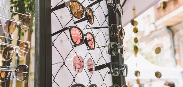 Close-up of metal fence against building