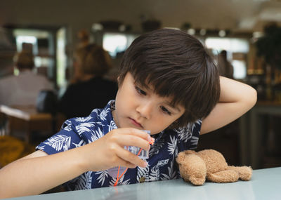 Portrait of boy with toy toys