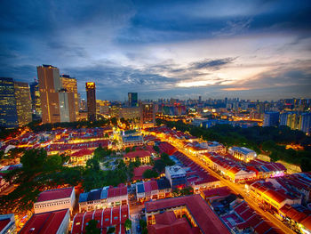 Aerial view of city lit up at night