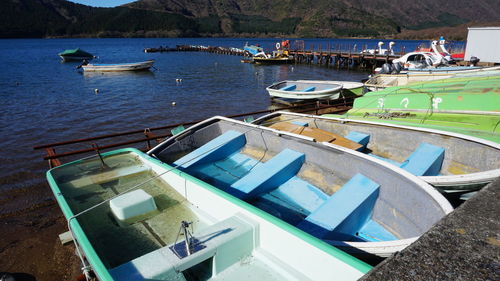 High angle view of boats moored at harbor