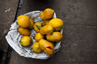 High angle view of fruits on wood