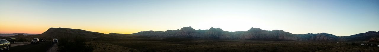 Scenic view of mountains against sky at sunset