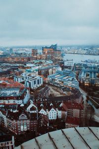 Aerial view of townscape against sky during winter