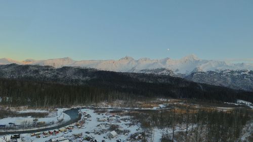 Scenic view of snowcapped mountains against clear sky