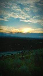 Scenic view of landscape against sky during sunset