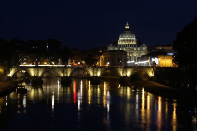 Reflection of illuminated buildings in water at night