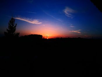 Scenic view of silhouette landscape against sky at sunset