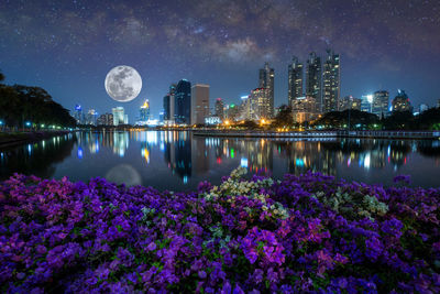 Scenic view of illuminated city against sky at night