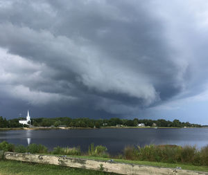 View of lake against cloudy sky