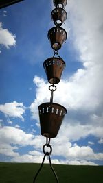 Low angle view of street light against cloudy sky