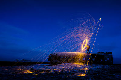 Fireworks against sky at night