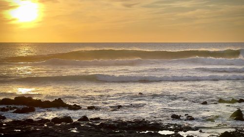 Scenic view of sea against sky during sunset