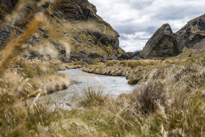 Rugged alpine landscape with a stream and rocks in new zealand