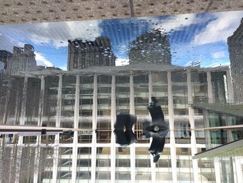 Woman standing in front of modern building